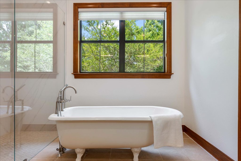 1525 Springlake Drive Dripping Springs, TX 78620 - Photo 15 of 38 a bathroom with a sink and a bathtub