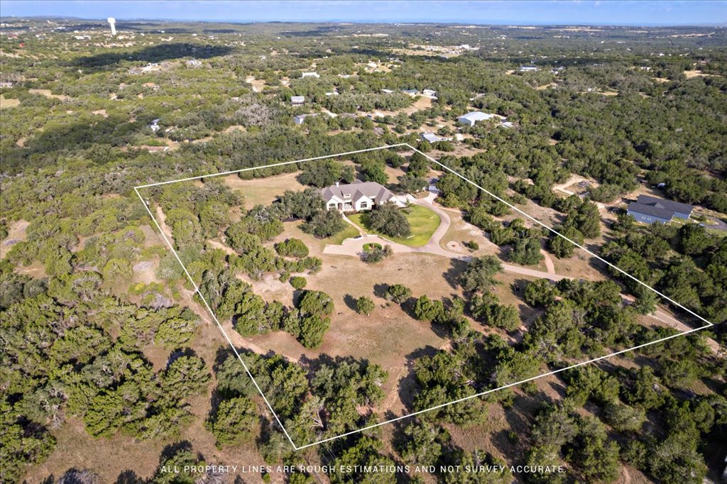 1525 Springlake Drive Dripping Springs, TX 78620 - Photo 36 of 38 an aerial view of residential houses with outdoor space