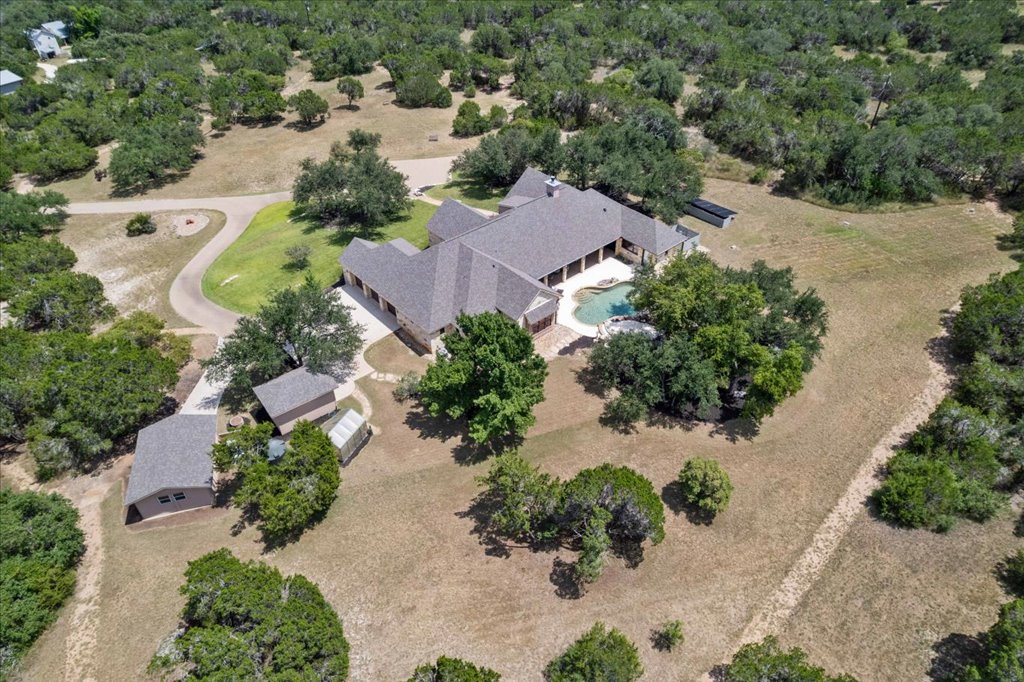 1525 Springlake Drive Dripping Springs, TX 78620 - Photo 37 of 38 an aerial view of a house with a garden