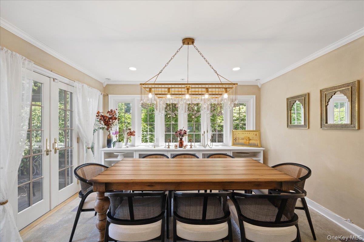 311 Lyncroft Road New Rochelle, NY 10804 - Photo 8 of 39 a dining room with furniture a rug and wooden floor