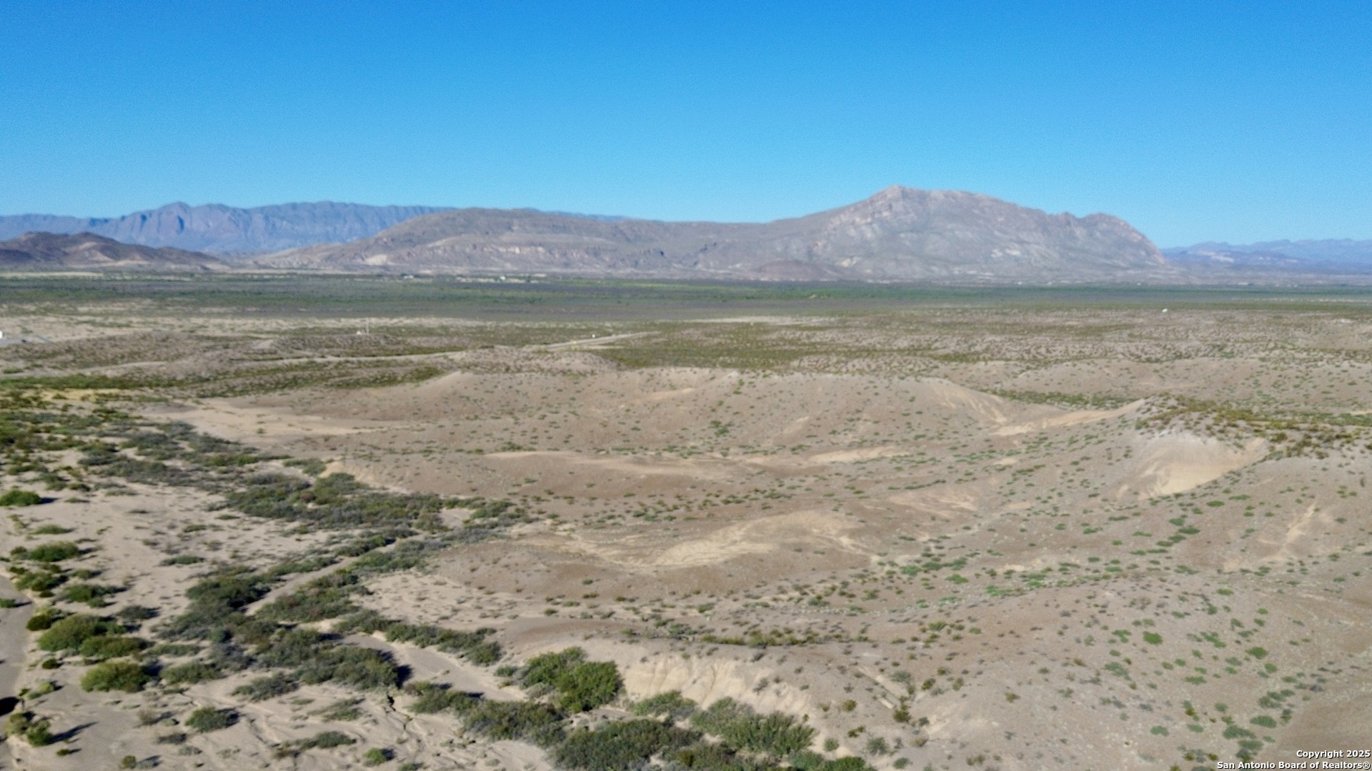 Tbd Tbd Presidio, TX 79845 - Photo 5 of 16 a view of a lake with a mountain in the background