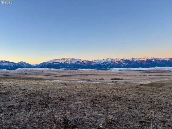 a view of lake with mountain in the background