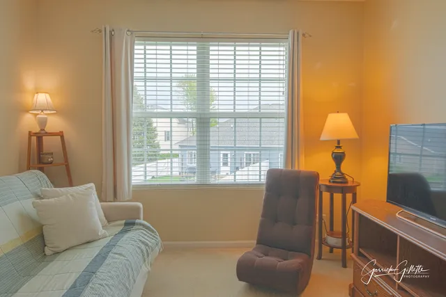a living room with furniture and a window