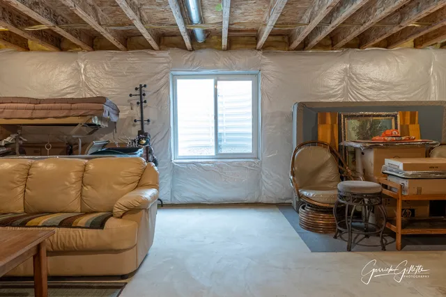 a living room with furniture and a window
