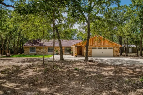 a house with a tree in front of it