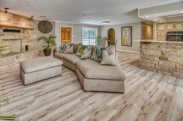 a living room with furniture and a fireplace