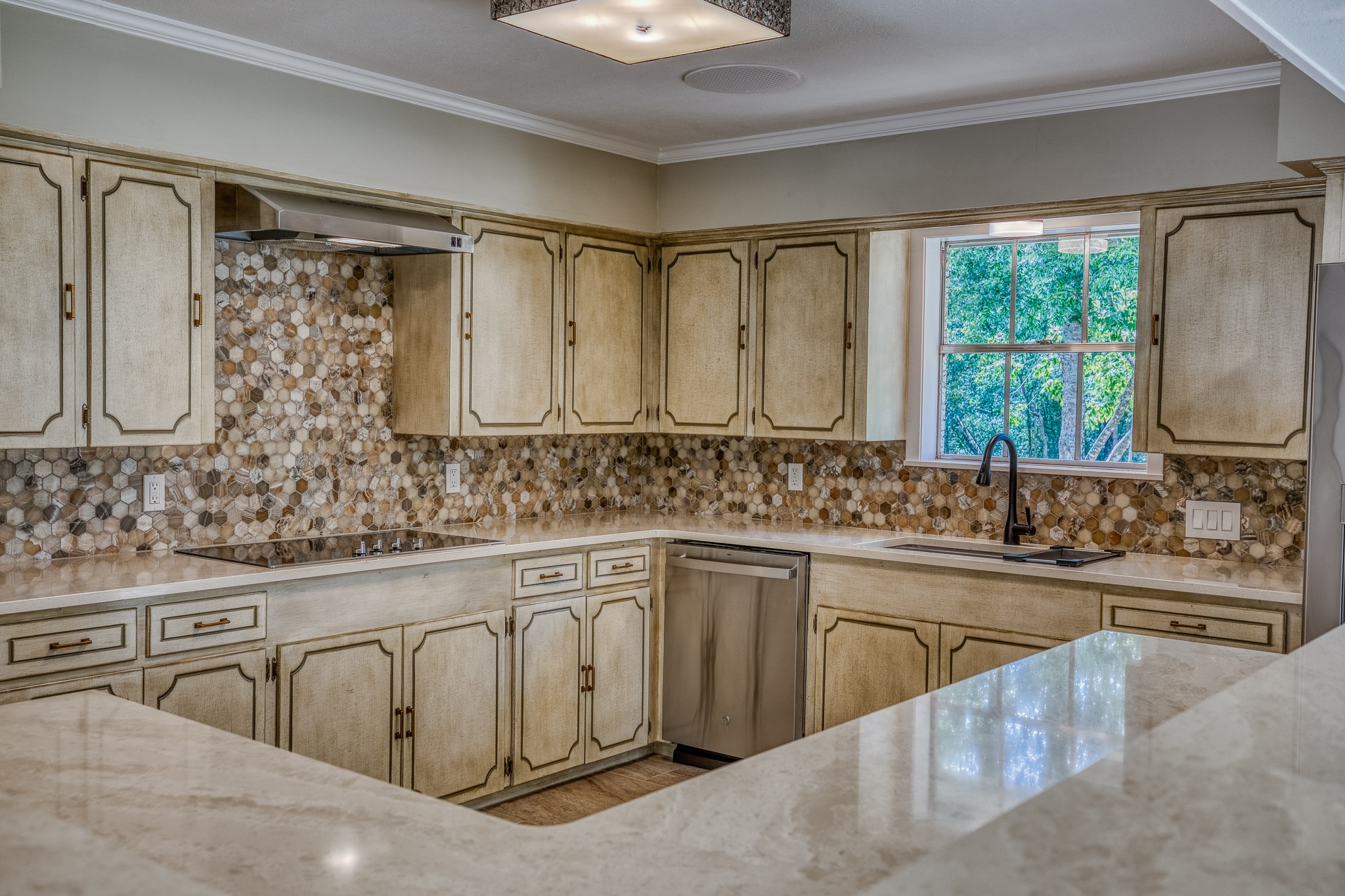 5504 Hillside Lane Brenham, TX 77833 - Photo 19 of 47 a kitchen with stainless steel appliances granite countertop a sink stove and cabinets