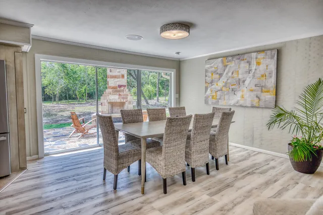 a view of house with backyard and outdoor seating