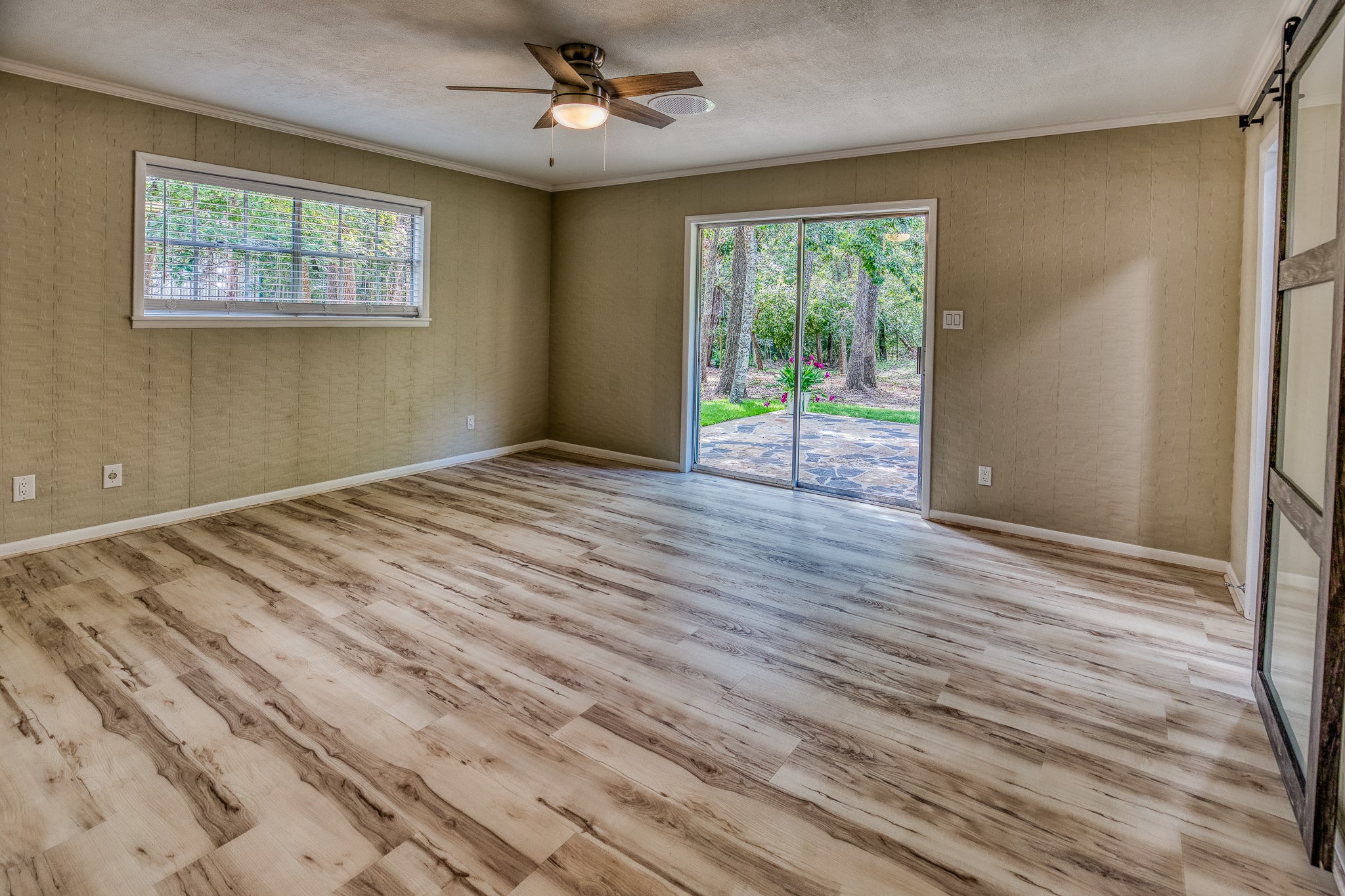 5504 Hillside Lane Brenham, TX 77833 - Photo 28 of 47 a view of empty room with wooden floor and fan