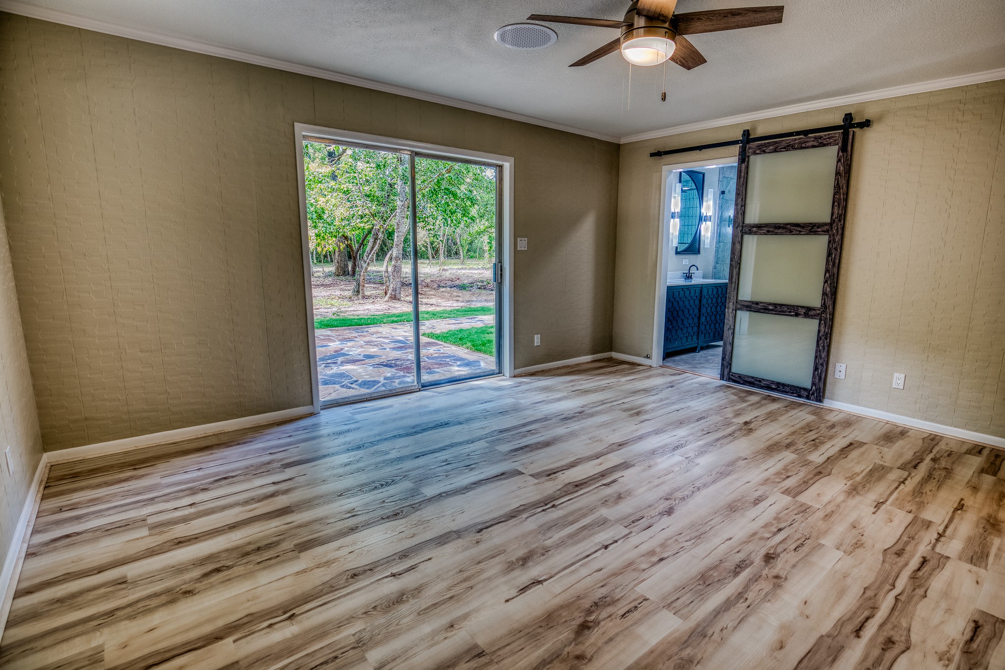 5504 Hillside Lane Brenham, TX 77833 - Photo 29 of 47 a view of empty room with wooden floor and fan