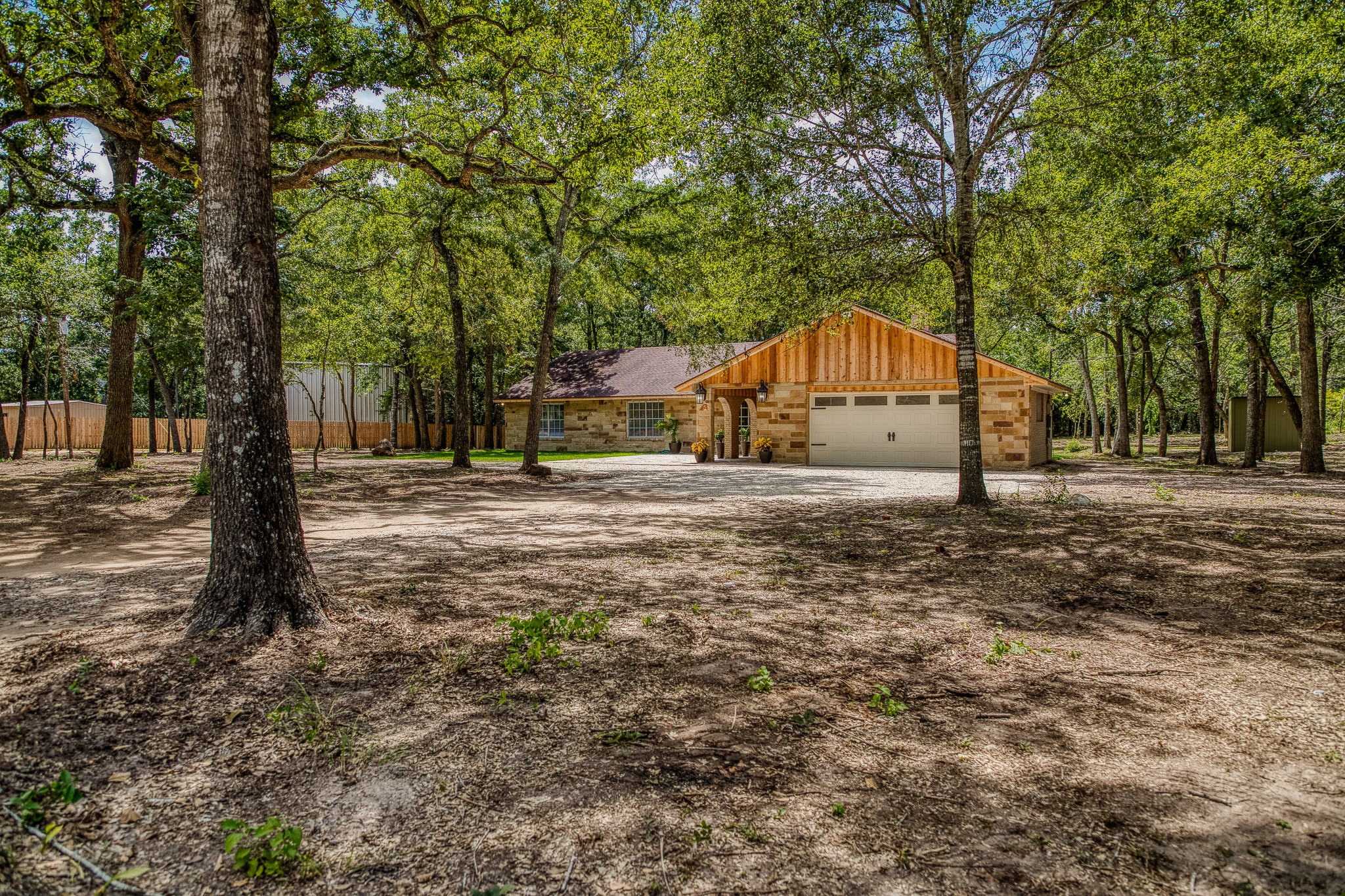 5504 Hillside Lane Brenham, TX 77833 - Photo 3 of 47 a view of large trees with a big yard