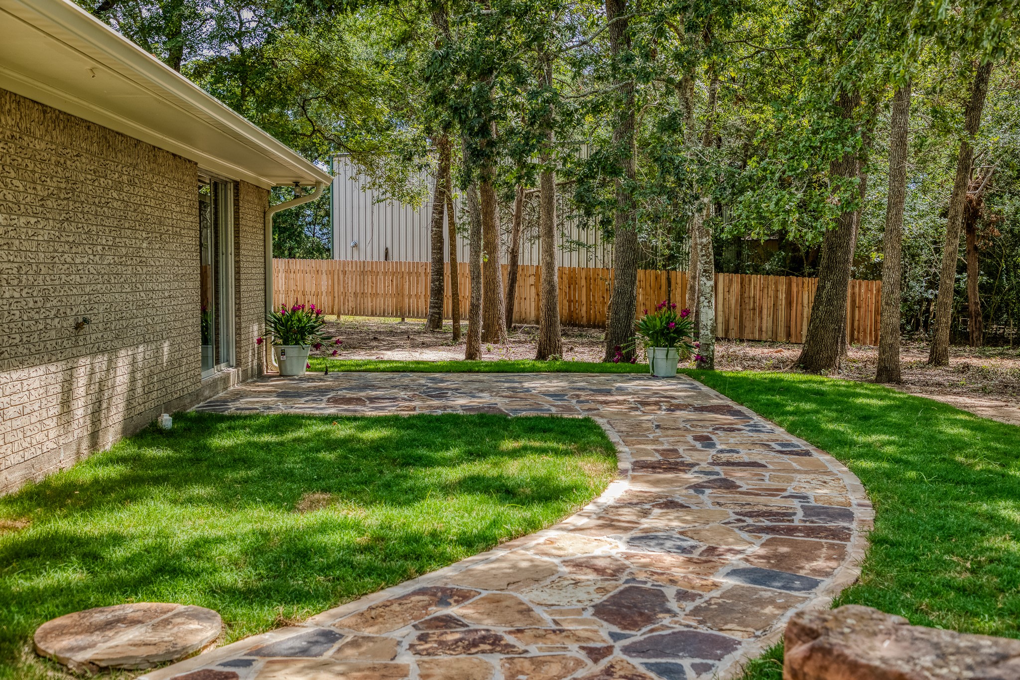 5504 Hillside Lane Brenham, TX 77833 - Photo 38 of 47 a backyard of a house with lots of green space