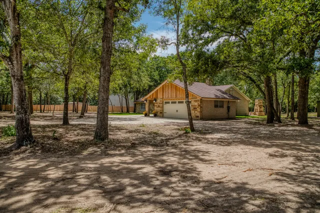 a house with trees in the background