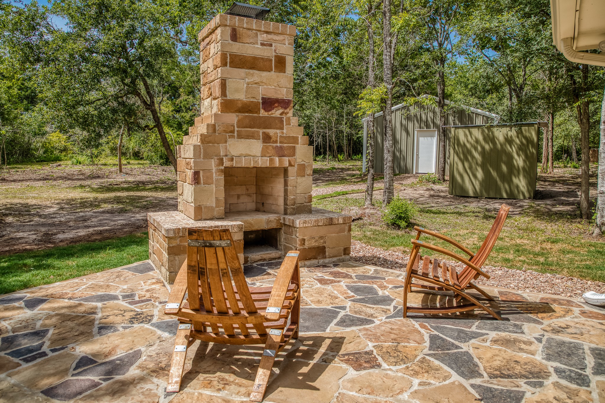 5504 Hillside Lane Brenham, TX 77833 - Photo 41 of 47 a view of a chairs and table in the backyard