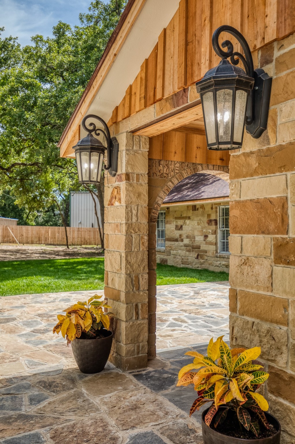 5504 Hillside Lane Brenham, TX 77833 - Photo 10 of 47 a view of a patio with a table and chairs and potted plants