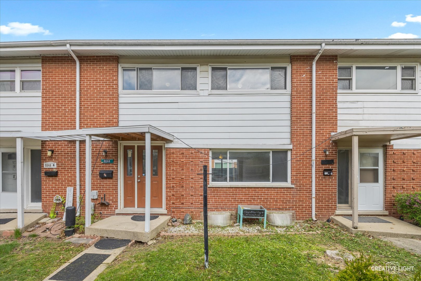 8044 West Lyons Street, Unit B Niles, IL 60714 - Photo 1 of 17 front view of a house with a yard