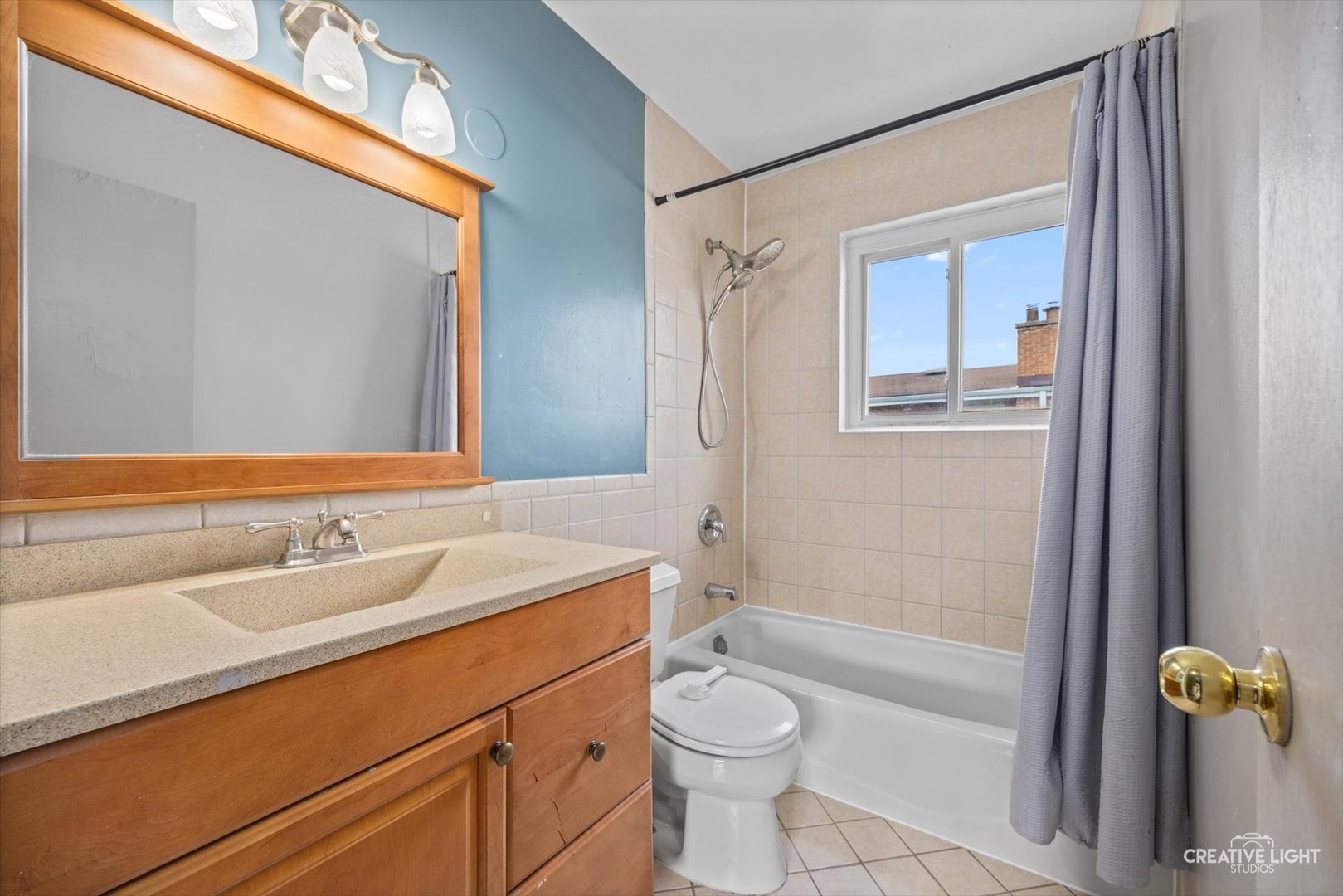 8044 West Lyons Street, Unit B Niles, IL 60714 - Photo 13 of 17 a bathroom with a granite countertop sink toilet and shower