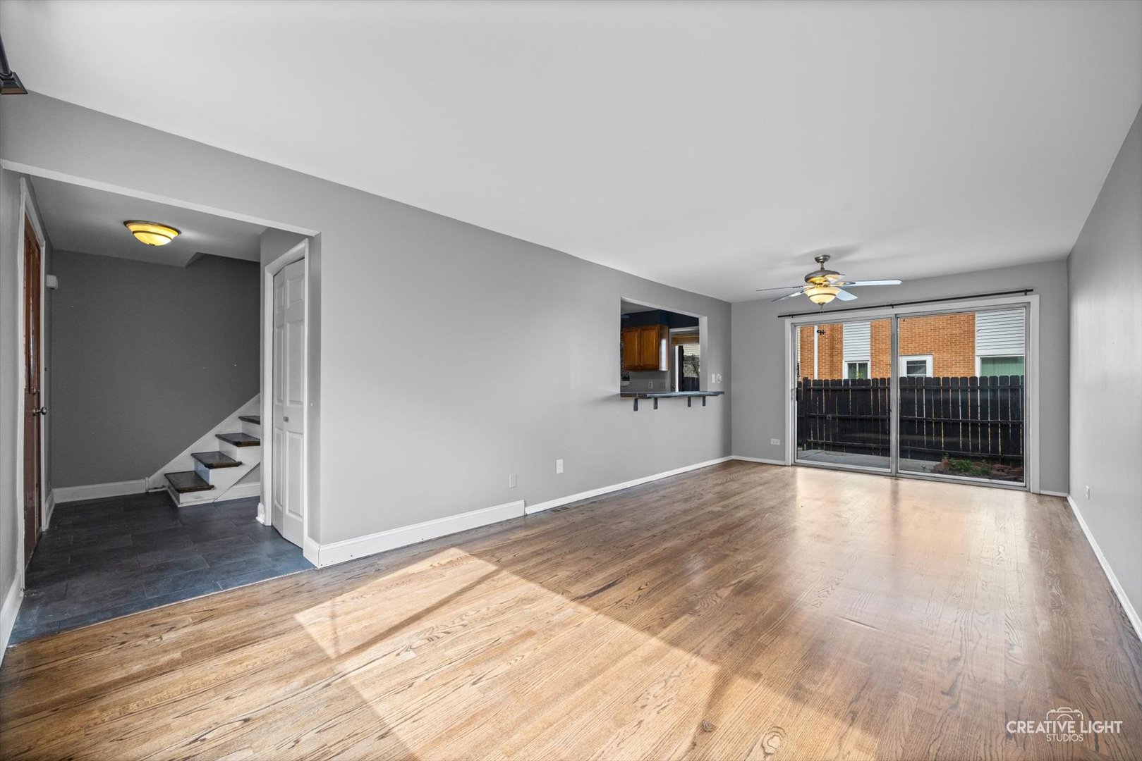 8044 West Lyons Street, Unit B Niles, IL 60714 - Photo 4 of 17 an empty room with wooden floor and windows