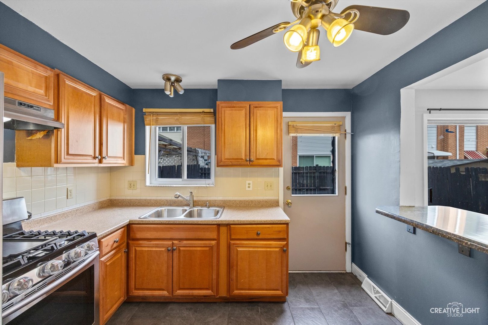 8044 West Lyons Street, Unit B Niles, IL 60714 - Photo 5 of 17 a kitchen with stainless steel appliances granite countertop a stove and a sink