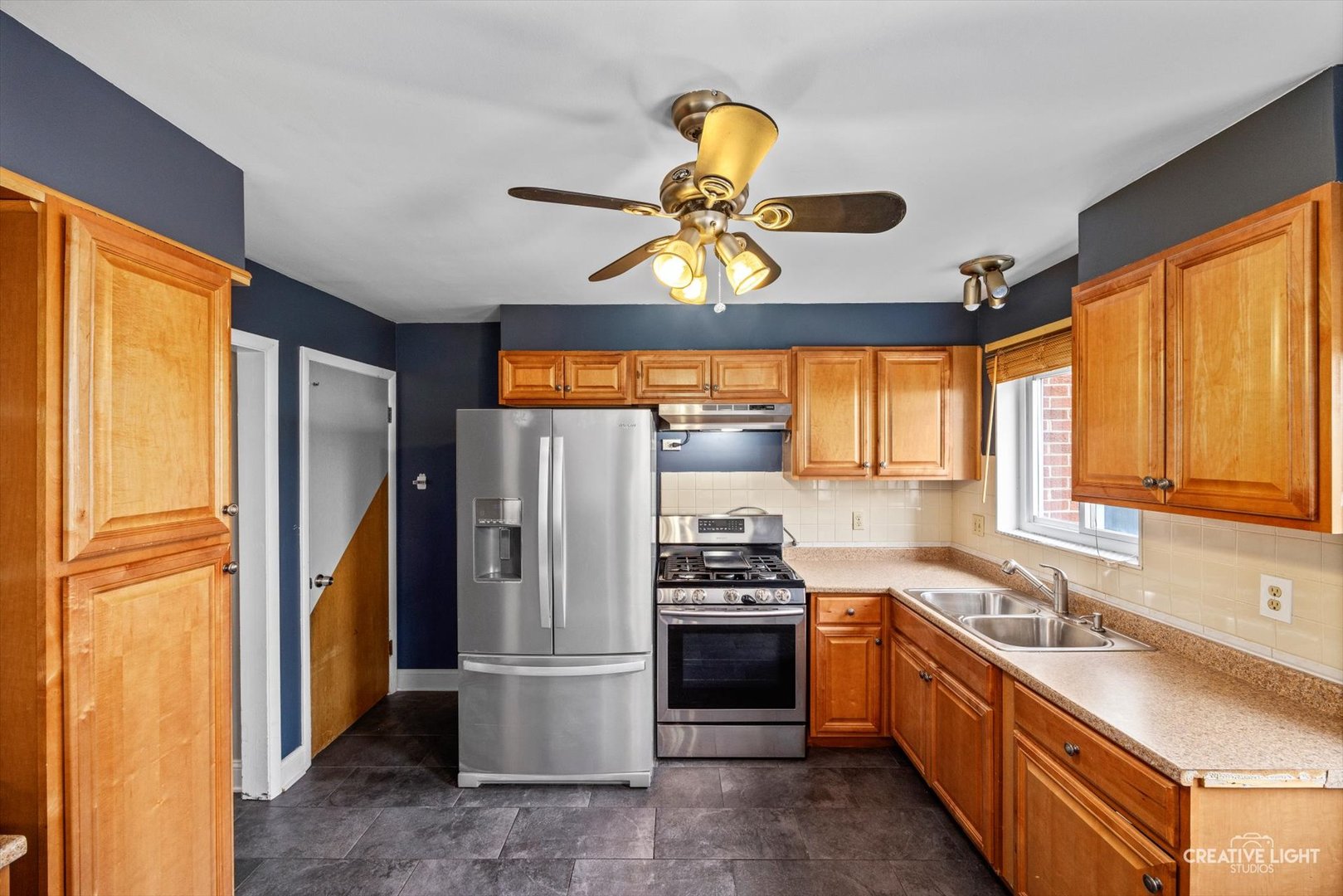 8044 West Lyons Street, Unit B Niles, IL 60714 - Photo 7 of 17 a kitchen with a sink stainless steel appliances and cabinets