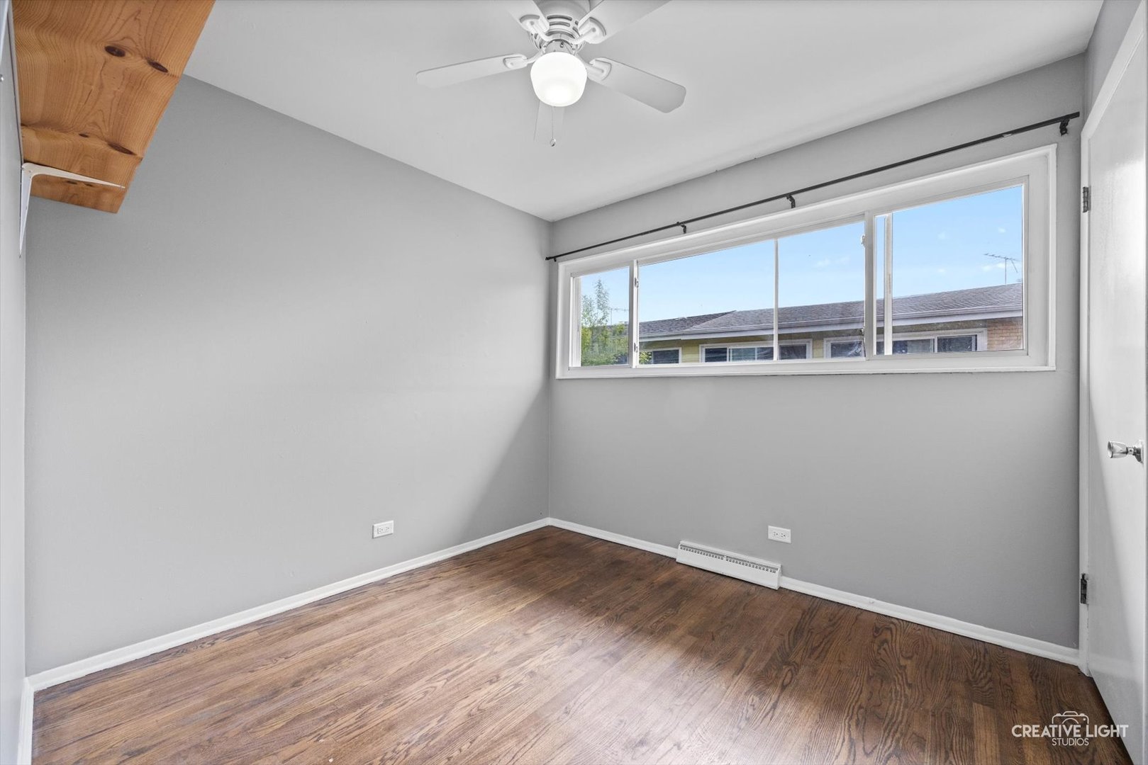 8044 West Lyons Street, Unit B Niles, IL 60714 - Photo 9 of 17 a view of a kitchen with wooden floor and chandelier