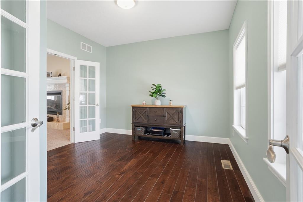 100 Mary Street Monaca, PA 15061 - Photo 11 of 49 an empty room with wooden floor and windows
