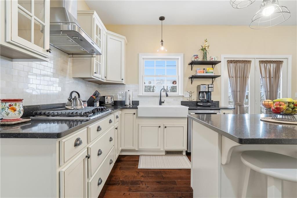 100 Mary Street Monaca, PA 15061 - Photo 17 of 49 a kitchen with stainless steel appliances granite countertop a sink a stove and a refrigerator