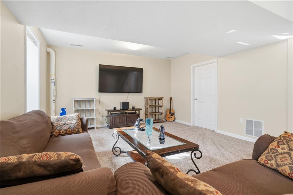 100 Mary Street Monaca, PA 15061 - Photo 36 of 49 a living room with furniture and a flat screen tv
