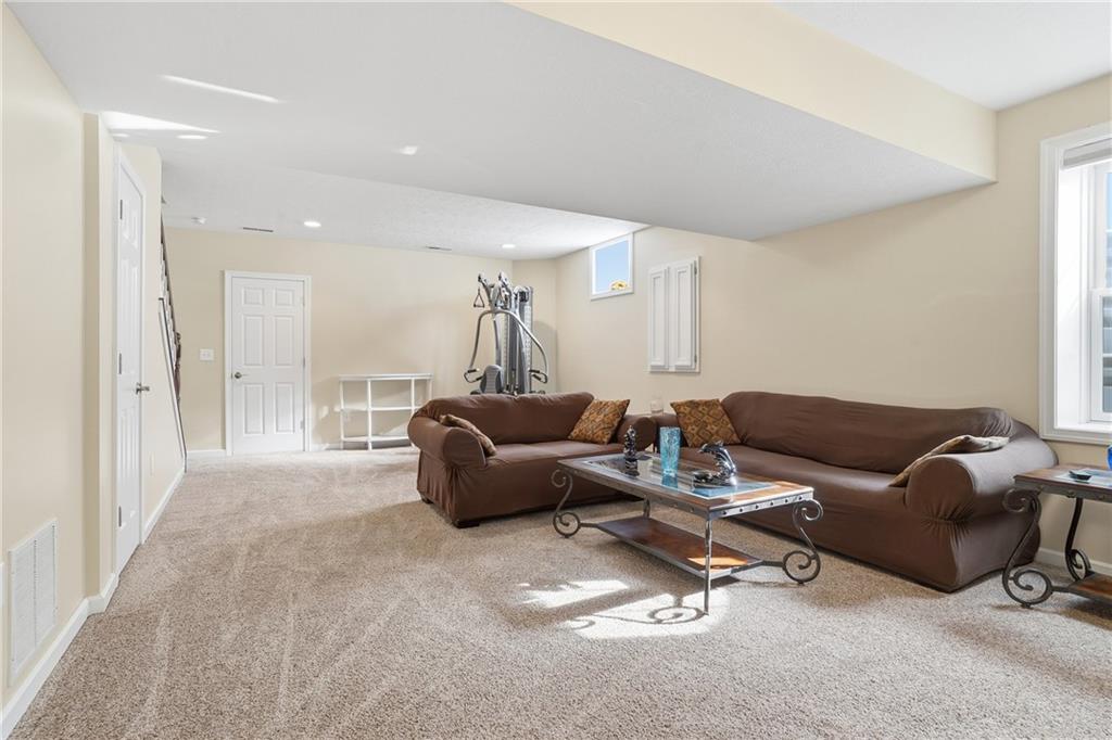 100 Mary Street Monaca, PA 15061 - Photo 37 of 49 a living room with furniture a couch and a chandelier