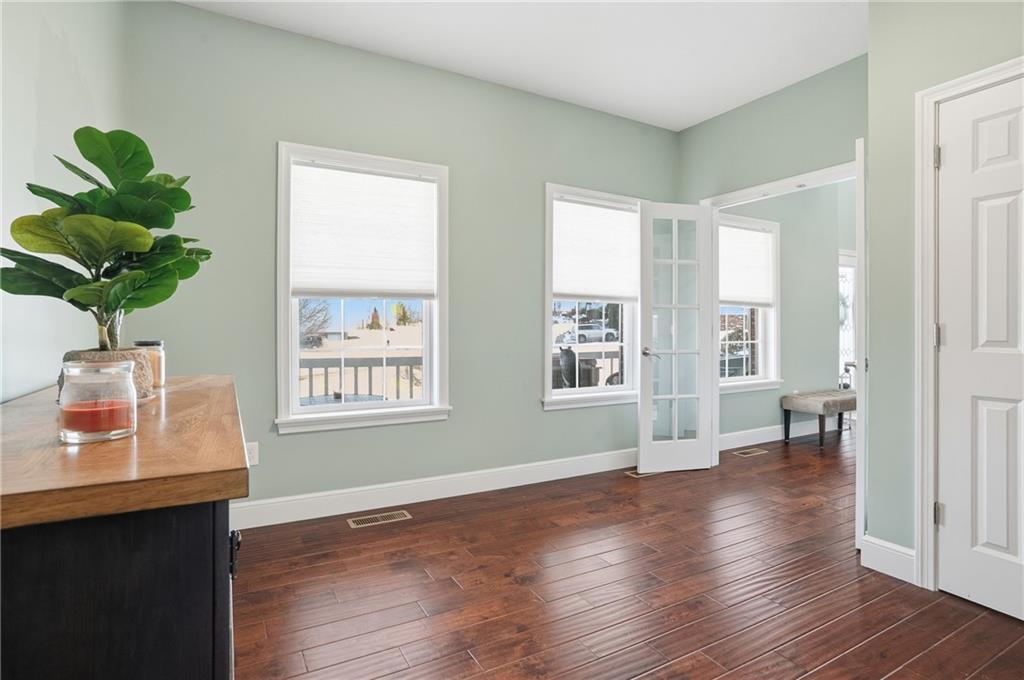 100 Mary Street Monaca, PA 15061 - Photo 10 of 49 a view of an empty room with a window and wooden floor