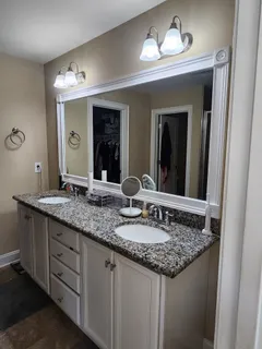 a spacious bedroom with a bed and a table in it