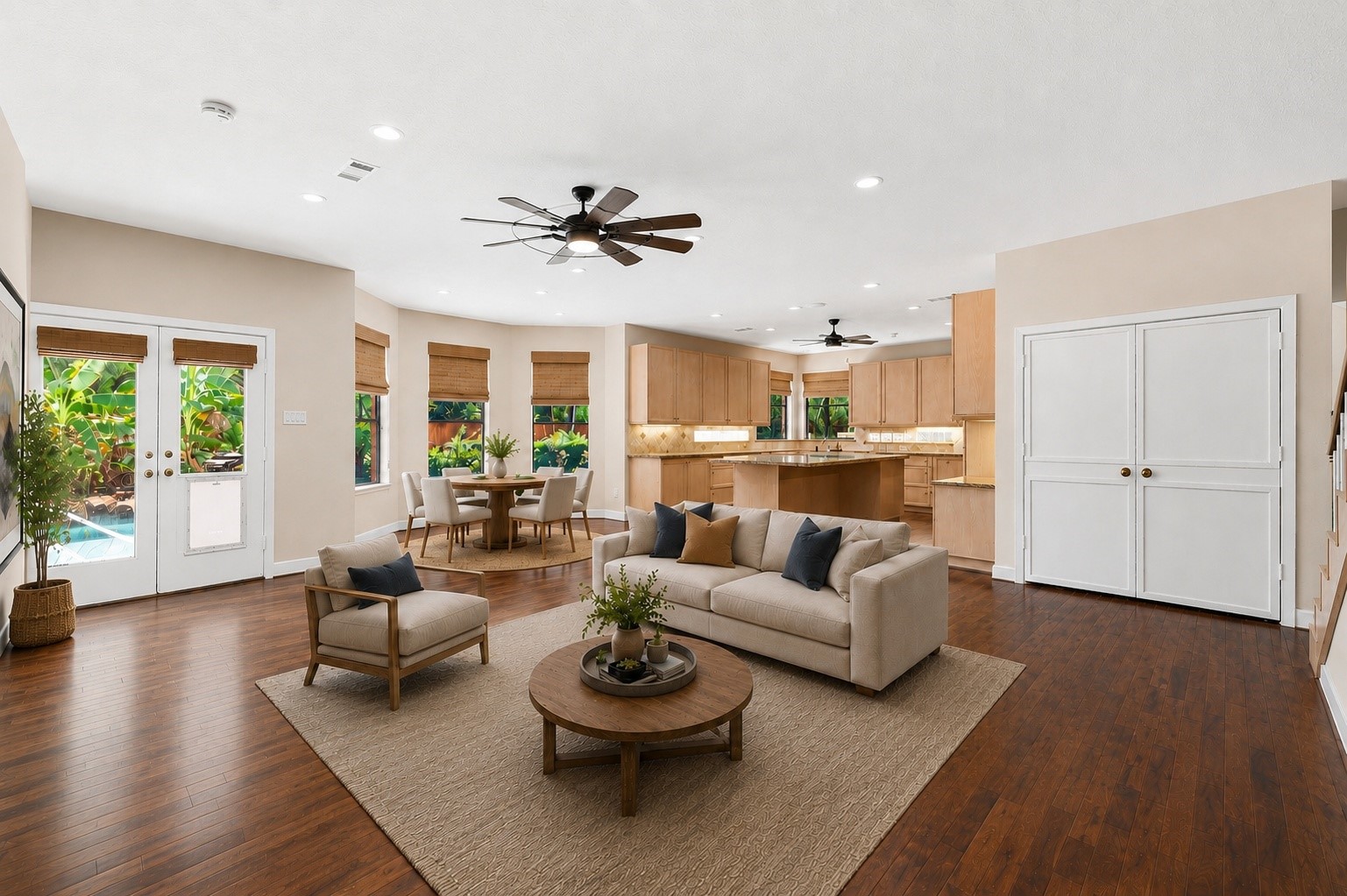 18503 Cabaniss Circle Spring, TX 77379 - Photo 15 of 49 The spacious family room flows seamlessly into the breakfast area and kitchen, creating an inviting space for everyday living and entertaining. (virtually staged)
