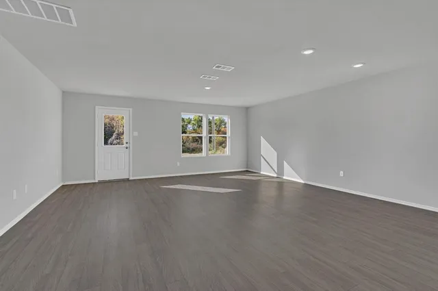 a view of kitchen with wooden floor and window