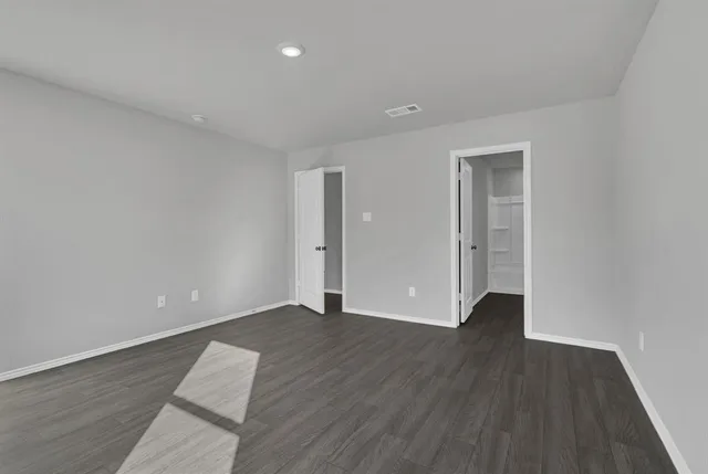a bathroom with a granite countertop sink a toilet and bathtub