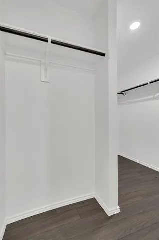 a view of an empty walk in closet