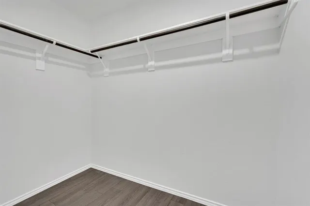 a bathroom with a toilet a sink and a mirror