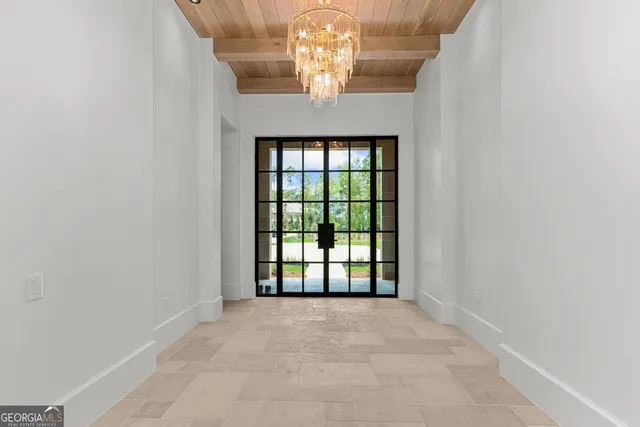 a kitchen with a stove a sink a refrigerator and a fireplace