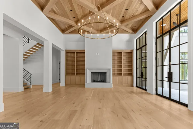 a kitchen with cabinets appliances and a window