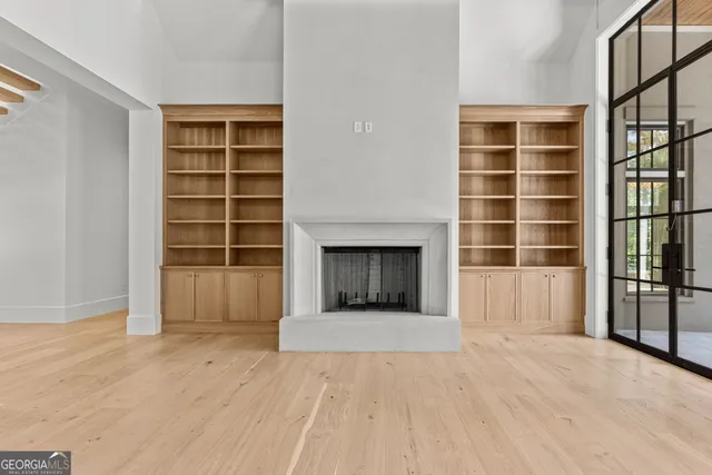 a view of an empty room with a large window