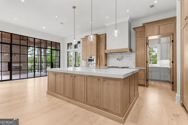 a view of an entryway with wooden floor and windows