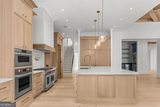 a utility room with sink dryer and washer