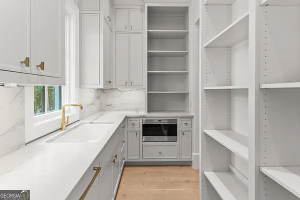 a kitchen with granite countertop a sink and a window
