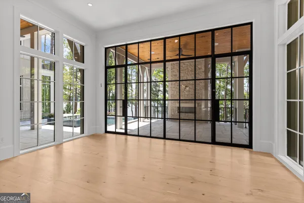 a view of entryway and hall with wooden floor