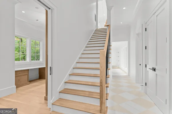 a bathroom with a granite countertop sink mirror and double
