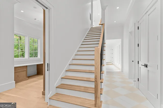 a bathroom with a granite countertop sink mirror and double