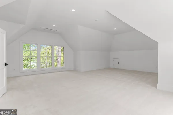 a bathroom with a sink toilet and a mirror