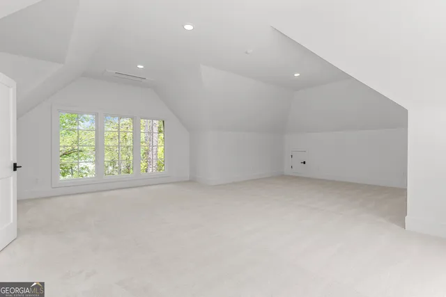 a bathroom with a sink toilet and a mirror