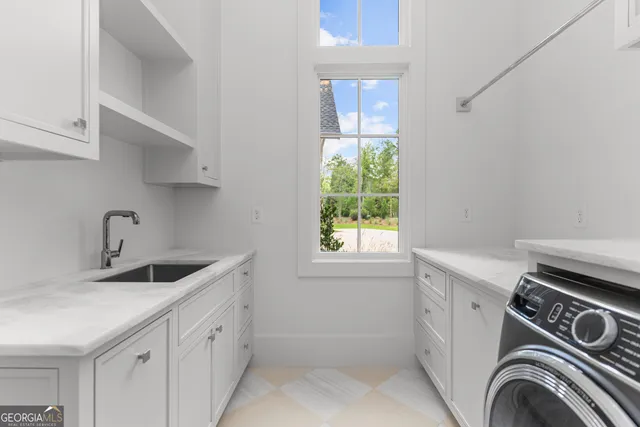 a spacious bedroom with a large bed and a large window