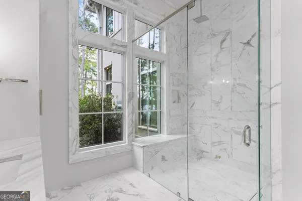 a view of a backyard with large trees