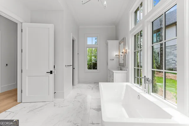 a view of outdoor space with a garden and trees